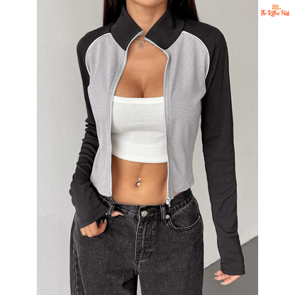 A light gray women’s autumn patchwork sports coat with turtleneck collar, full zipper, long sleeves, and thick knit streetwear design.