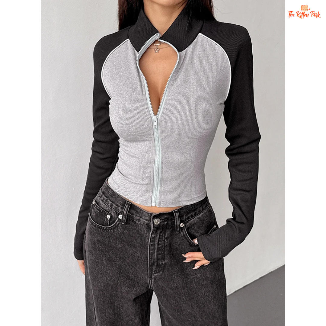 A light gray women’s autumn patchwork sports coat with turtleneck collar, full zipper, long sleeves, and thick knit streetwear design.