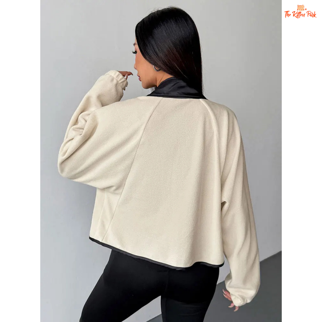 A beige women’s autumn patchwork wool coat with V-neck, zipper and button closure, long sleeves, and streetwear slim fit style.