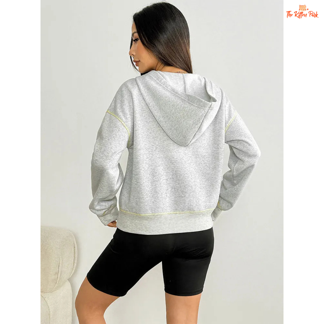 Women’s Autumn Streetwear Sports Hoodie featuring a soft fur liner, half-zip front, and hooded slim-fit pullover design in light grey tones.