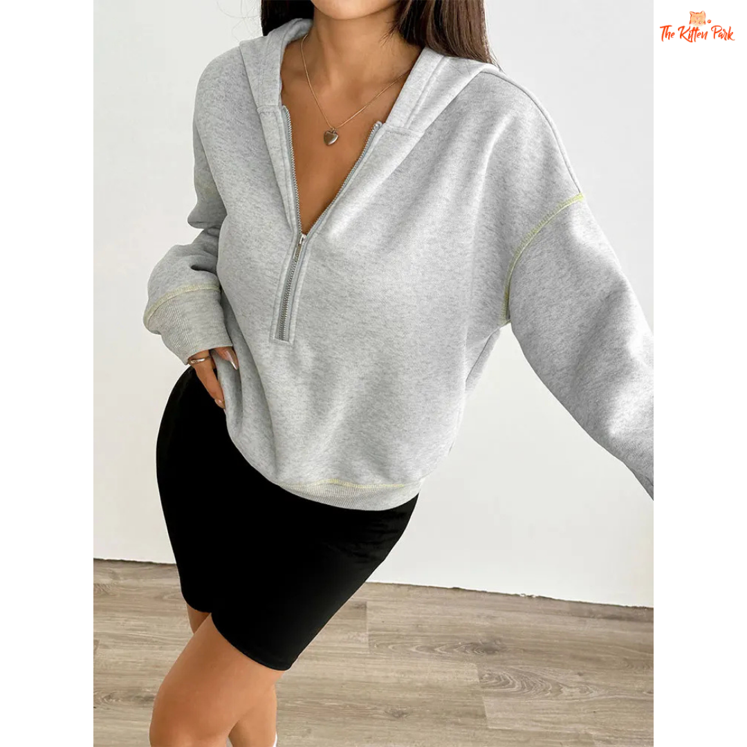 Women’s Autumn Streetwear Sports Hoodie featuring a soft fur liner, half-zip front, and hooded slim-fit pullover design in light grey tones.