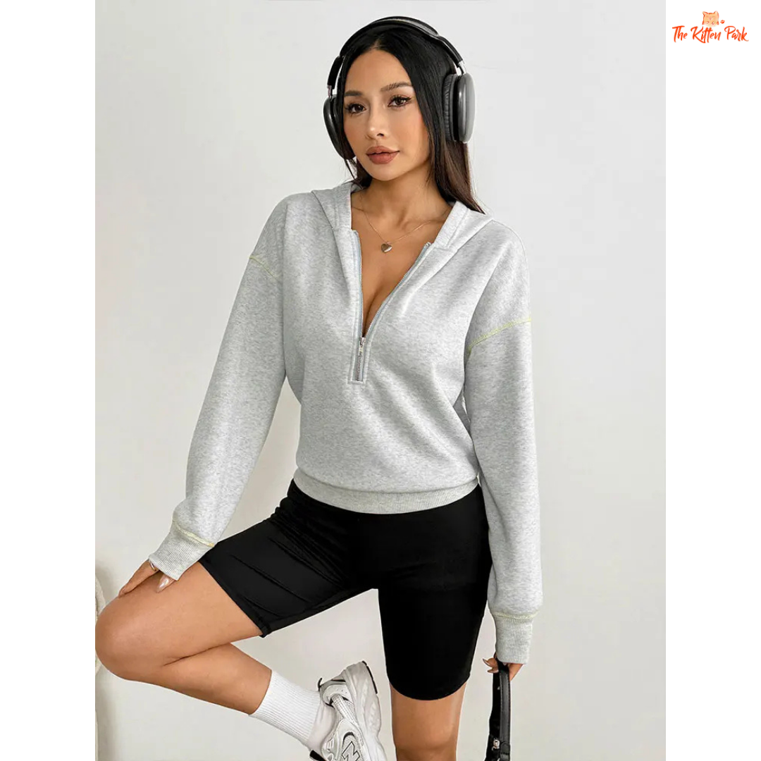 Women’s Autumn Streetwear Sports Hoodie featuring a soft fur liner, half-zip front, and hooded slim-fit pullover design in light grey tones.