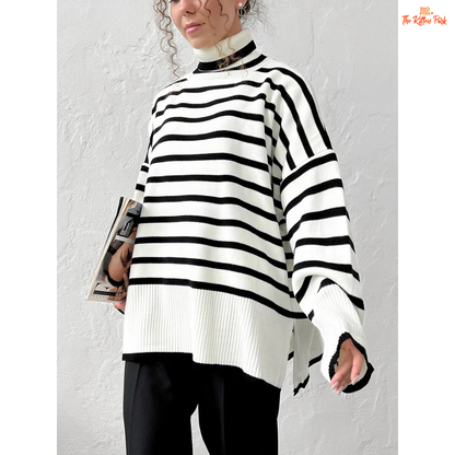 Person wearing a black and white striped sweater against a plain background