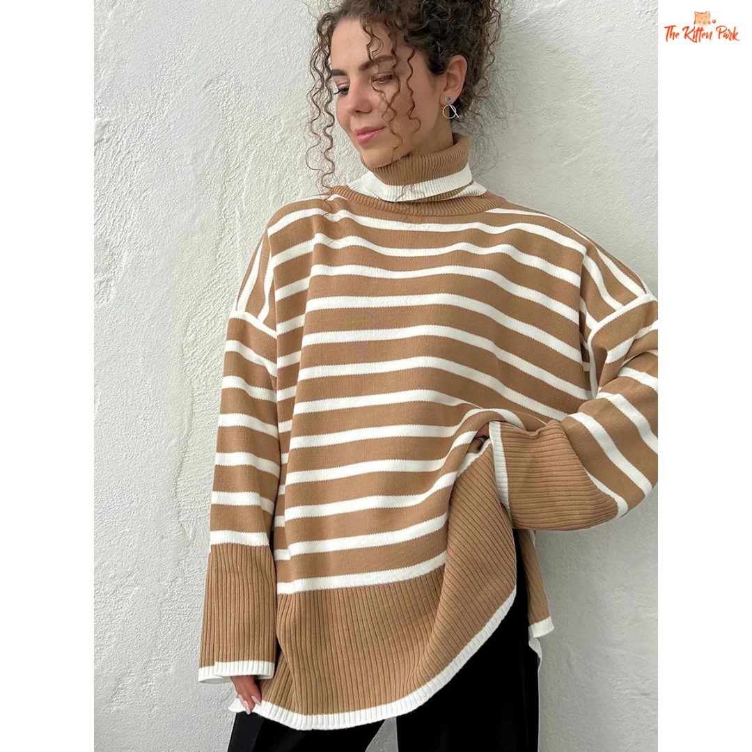 Person wearing a brown and white striped sweater against a white wall.