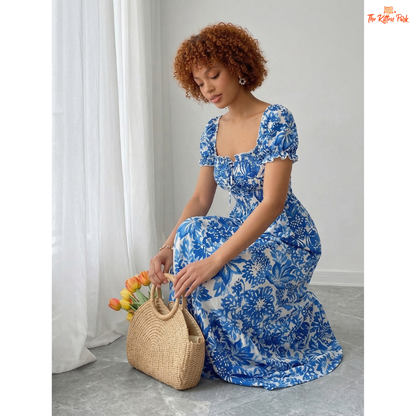Blue floral maxi dress with puff sleeves, square neckline, tie front bow, and flowy A-line silhouette for summer.