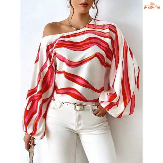 Women's off-shoulder printed blouse with puff sleeves, slash neckline, and a loose fit for spring and summer casual elegance.