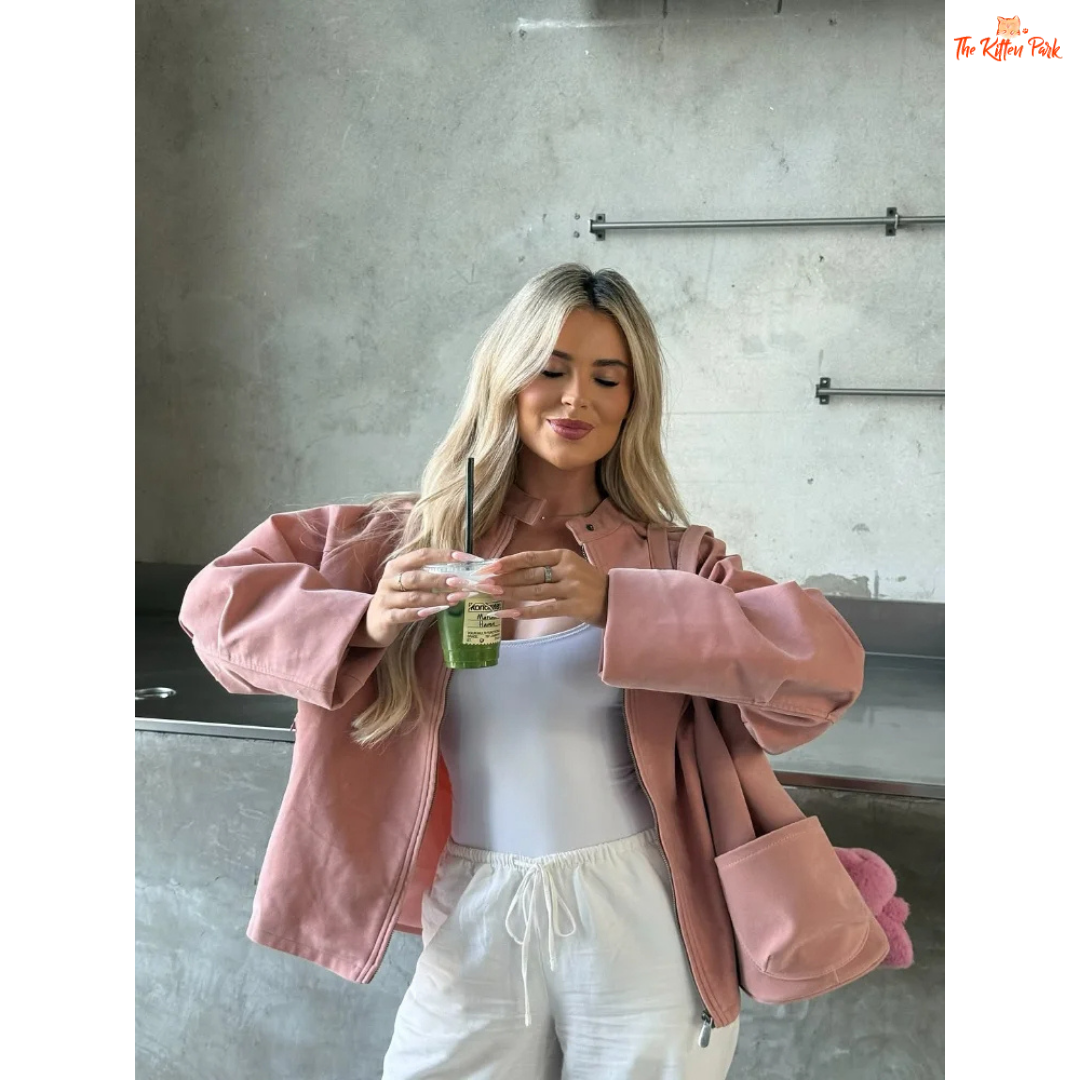 Women's pink suede coat with zipper closure and pockets, elegant long sleeve high street fashion jacket for autumn and winter.