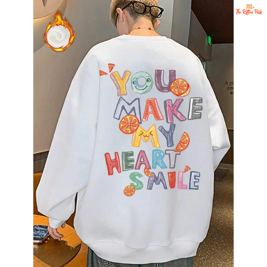 A women’s cozy fleece pullover sweatshirt in off-white with the printed phrase "You Make My Heart Smile," featuring a loose fit and O-neck design.