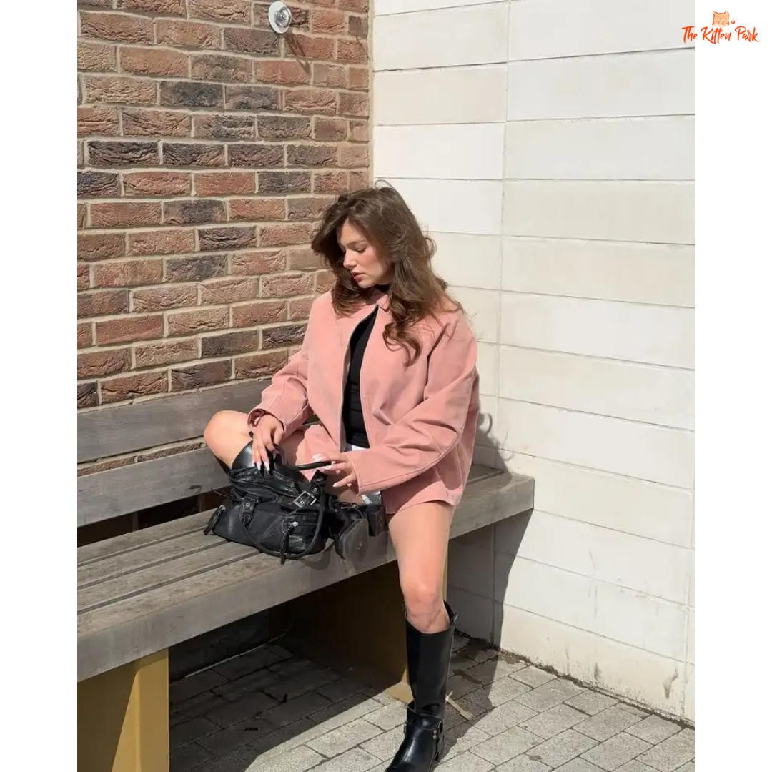 Women's pink suede coat with zipper closure and pockets, elegant long sleeve high street fashion jacket for autumn and winter.