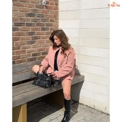 Women's pink suede coat with zipper closure and pockets, elegant long sleeve high street fashion jacket for autumn and winter.