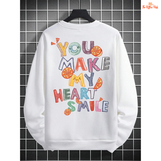 A women’s cozy fleece pullover sweatshirt in off-white with the printed phrase "You Make My Heart Smile," featuring a loose fit and O-neck design.