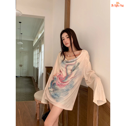 Long beige knit tee for women featuring a cowl neckline, hand-painted print, beaded accents, and a loose fit for stylish autumn layering.