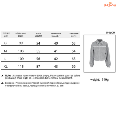 Size chart and product image of a gray shirt with white patterns on a white background