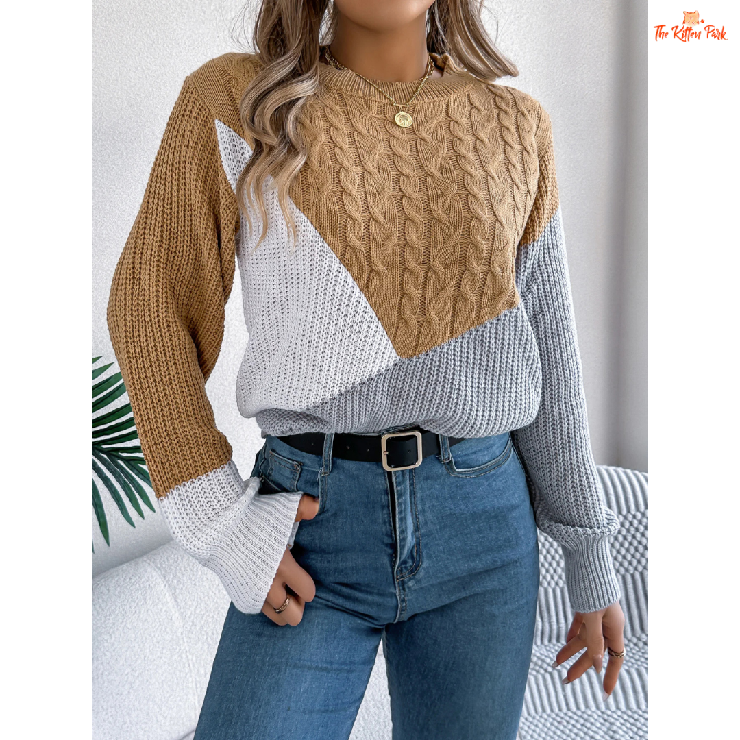 A women’s acrylic pullover sweater with color block patchwork design, O-neck, and full sleeves, crafted in heavyweight knit for autumn and winter wear.