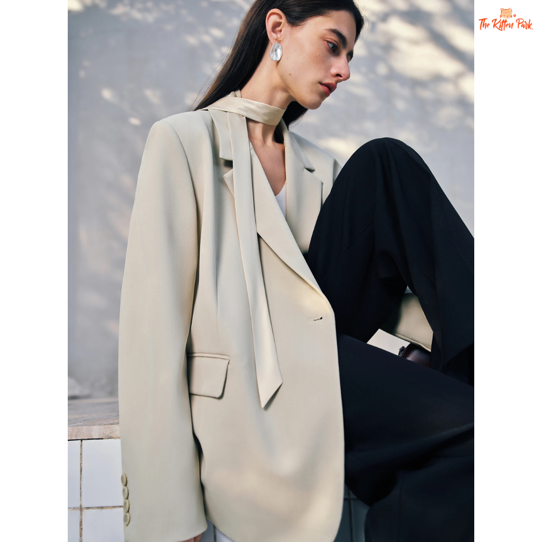 Women’s chic blazer jacket in polyester-spandex blend with single-breasted closure, button detail, and casual versatile design for spring and summer.