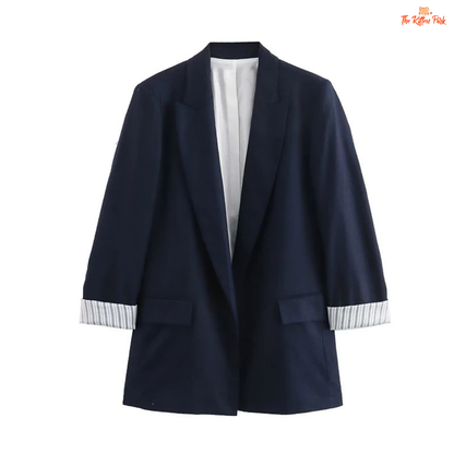 Chic women’s vintage blazer with a notched collar, long sleeves, loose fit, and pocket details in a minimalist solid design, ideal for autumn and winter wear.