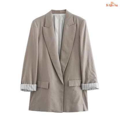 Chic women’s vintage blazer with a notched collar, long sleeves, loose fit, and pocket details in a minimalist solid design, ideal for autumn and winter wear.