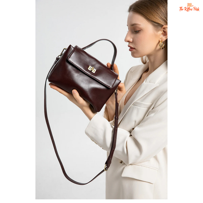 Soft cowhide leather tote bag for women featuring satchel shape, hasp closure, and multi-pocket cotton-lined interior with casual elegance.