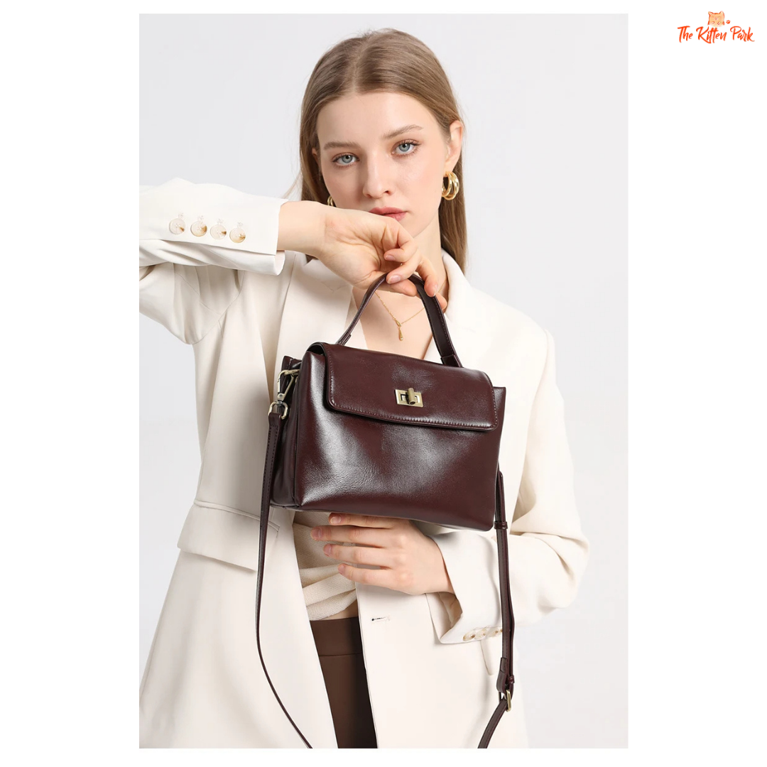 Soft cowhide leather tote bag for women featuring satchel shape, hasp closure, and multi-pocket cotton-lined interior with casual elegance.