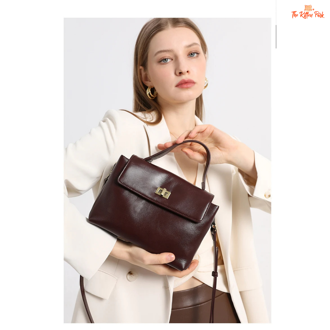 Soft cowhide leather tote bag for women featuring satchel shape, hasp closure, and multi-pocket cotton-lined interior with casual elegance.