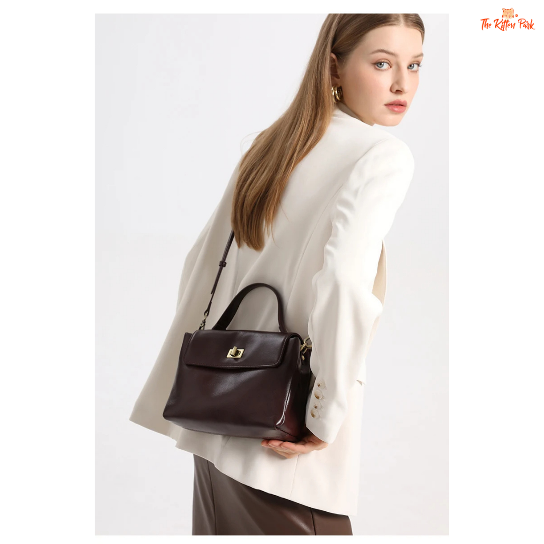 Soft cowhide leather tote bag for women featuring satchel shape, hasp closure, and multi-pocket cotton-lined interior with casual elegance.