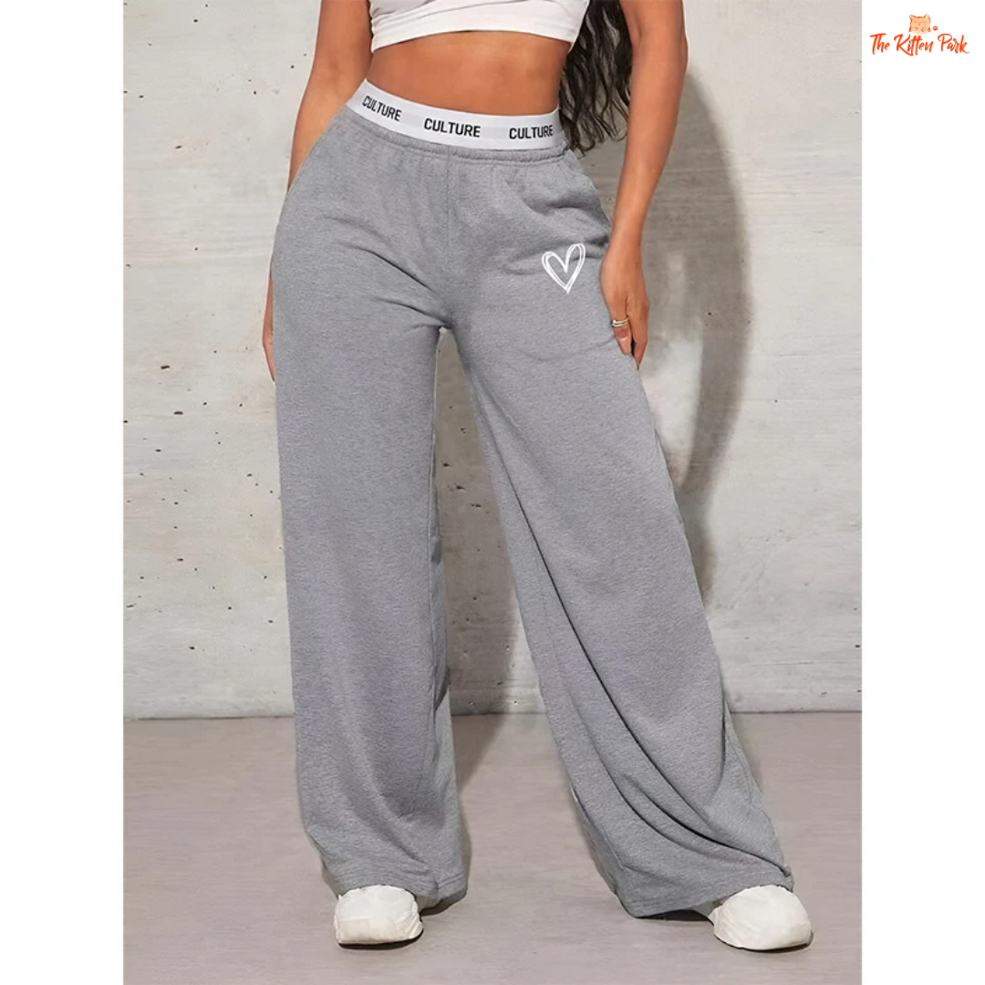 Wide-leg trousers for women with LOVE print, mid-rise elastic waist, and pockets — designed in a casual, loose-fit silhouette for all-season wear.