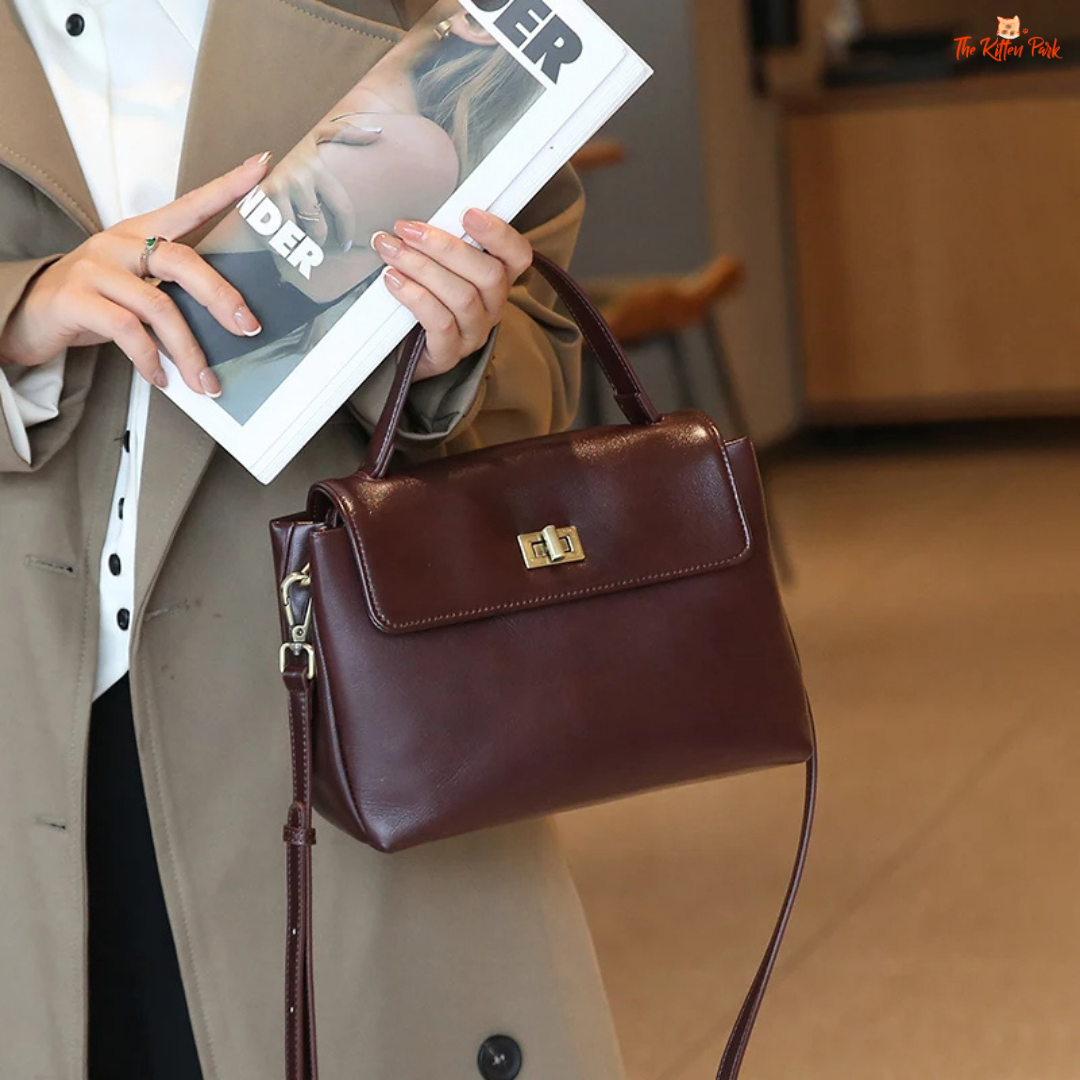 Soft cowhide leather tote bag for women featuring satchel shape, hasp closure, and multi-pocket cotton-lined interior with casual elegance.