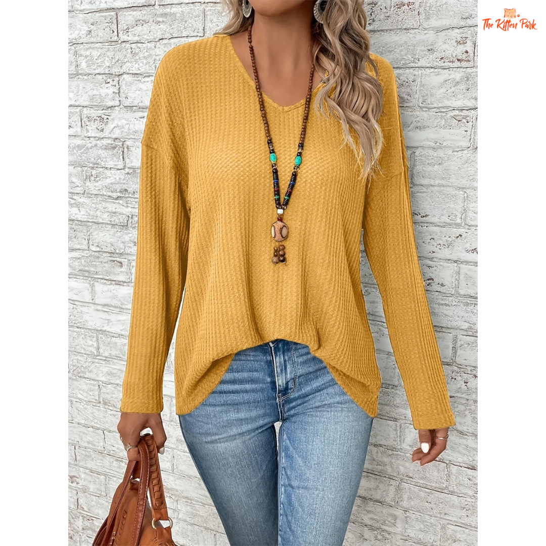 Women’s Dropped Shoulder V-Neck Solid Loose T-Shirt in mustard yellow, featuring lightweight knit fabric, casual fit, and soft blended texture for spring and summer.