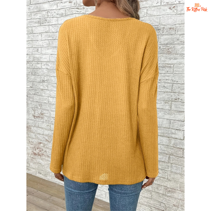 Women’s Dropped Shoulder V-Neck Solid Loose T-Shirt in mustard yellow, featuring lightweight knit fabric, casual fit, and soft blended texture for spring and summer.