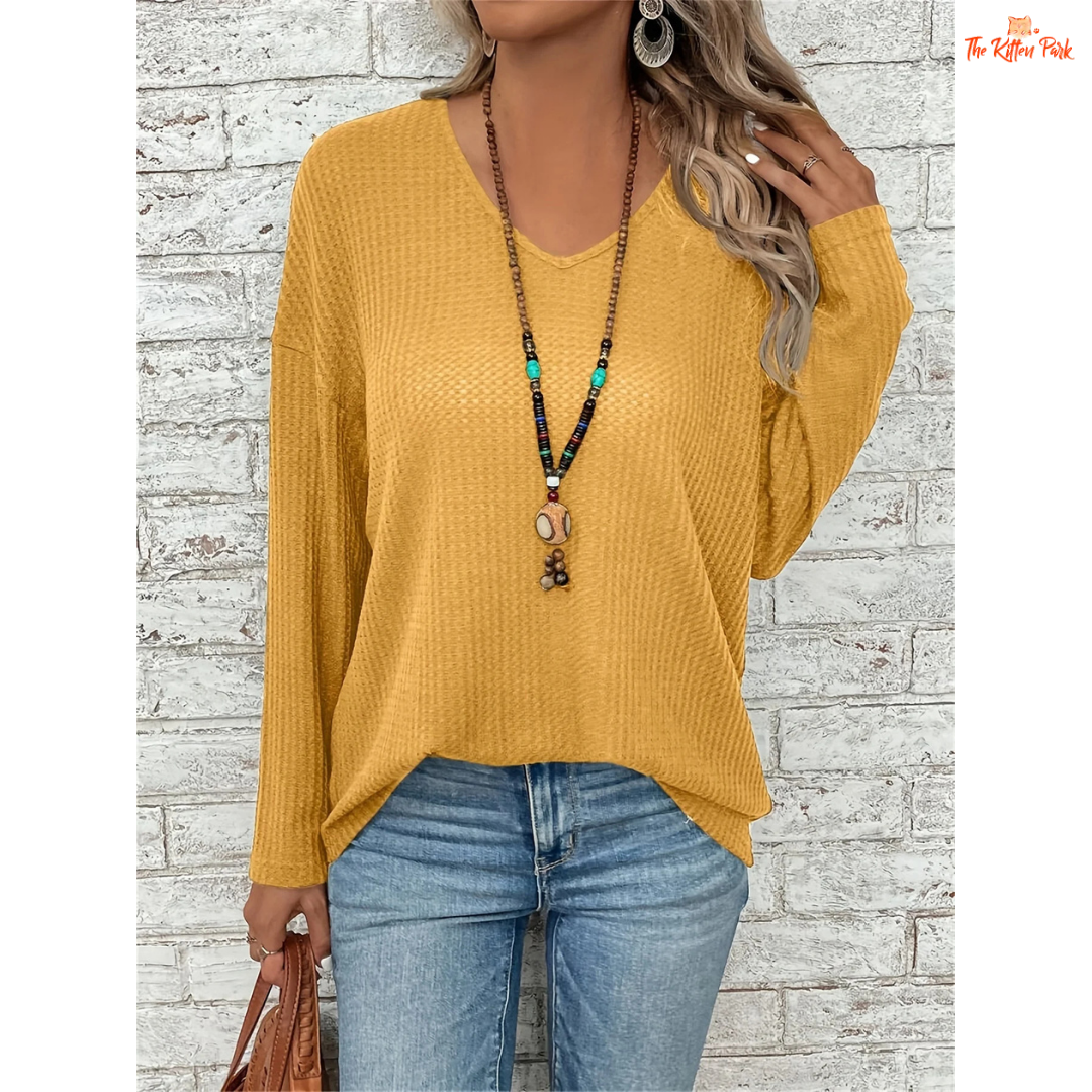 Women’s Dropped Shoulder V-Neck Solid Loose T-Shirt in mustard yellow, featuring lightweight knit fabric, casual fit, and soft blended texture for spring and summer.