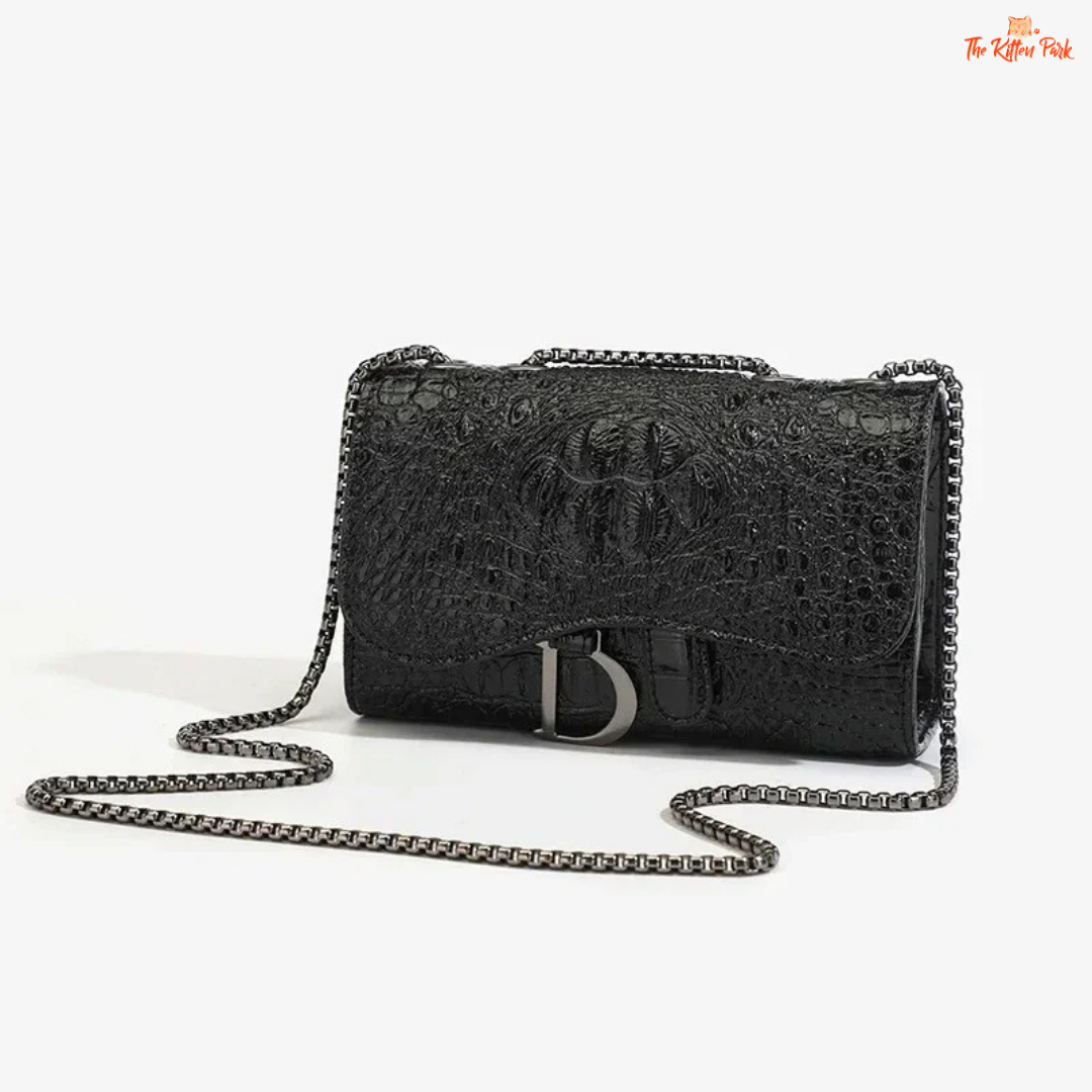 Box-shaped women's crossbody bag with sequins, animal print details, chain strap, and zippered interior for a stylish and glamorous look.