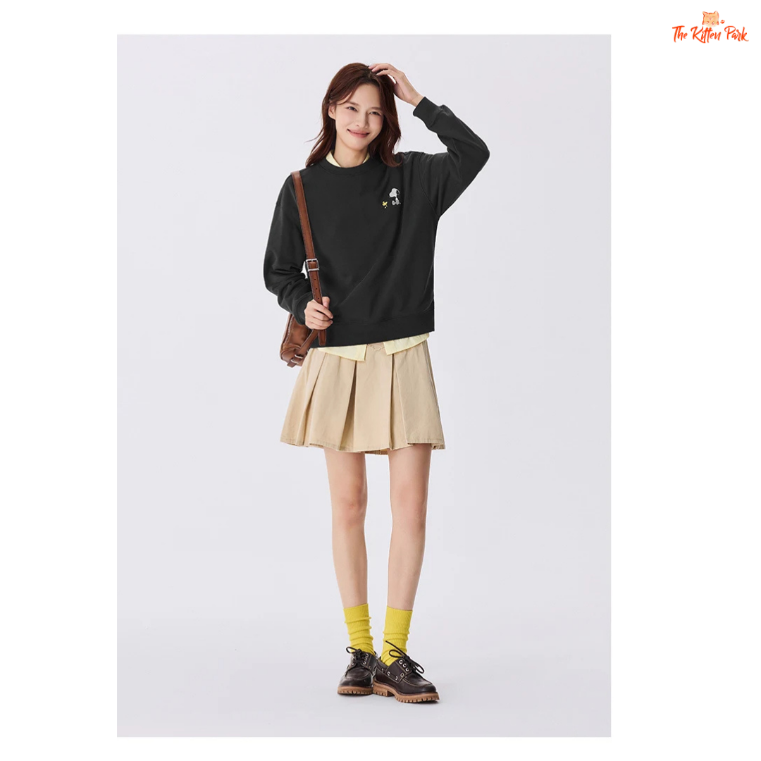 A women’s loose fit autumn sweatshirt with cartoon print, O-neck pullover design, and casual cotton-polyester blend comfort.
