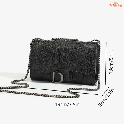 Box-shaped women's crossbody bag with sequins, animal print details, chain strap, and zippered interior for a stylish and glamorous look.