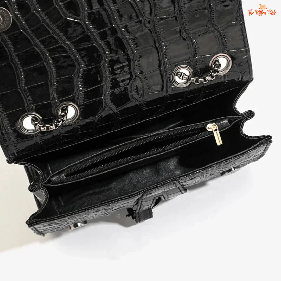 Box-shaped women's crossbody bag with sequins, animal print details, chain strap, and zippered interior for a stylish and glamorous look.