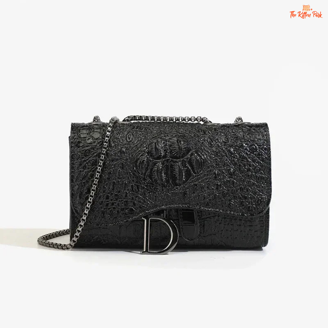 Box-shaped women's crossbody bag with sequins, animal print details, chain strap, and zippered interior for a stylish and glamorous look.