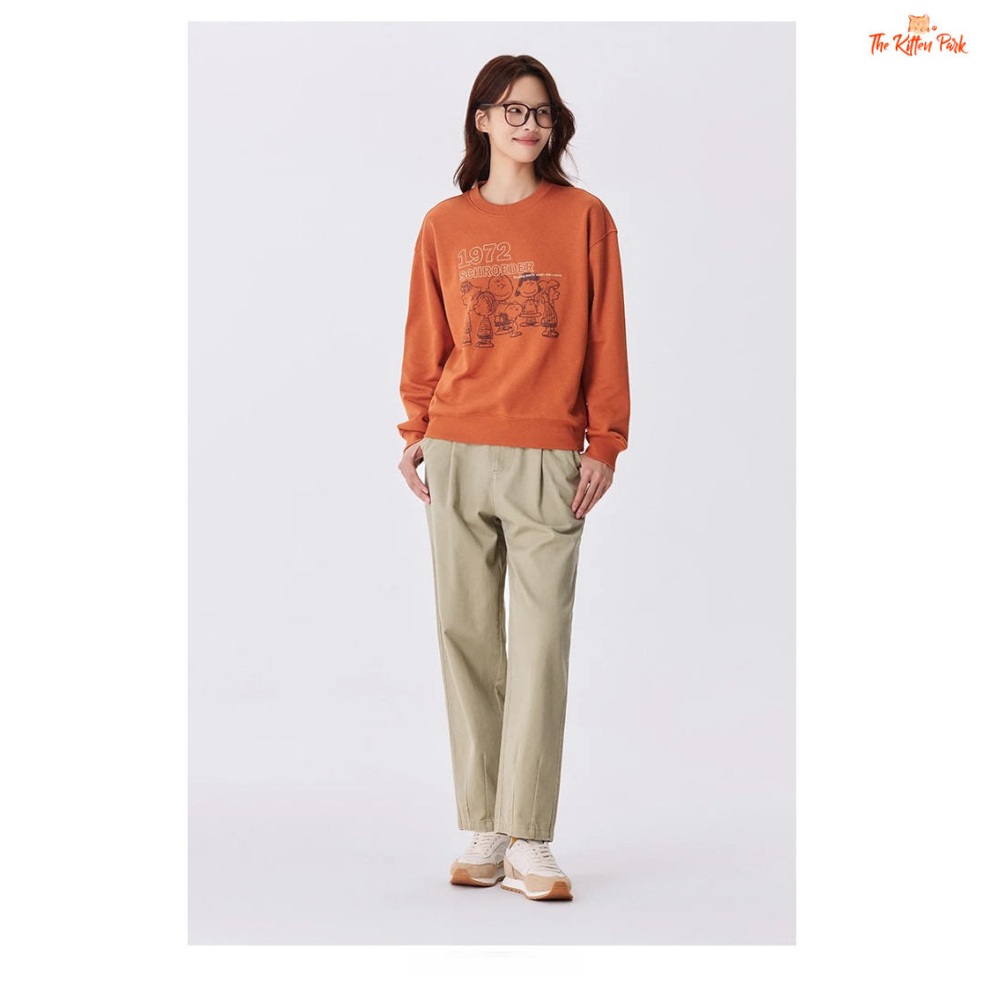 A women’s loose fit autumn sweatshirt with cartoon print, O-neck pullover design, and casual cotton-polyester blend comfort.