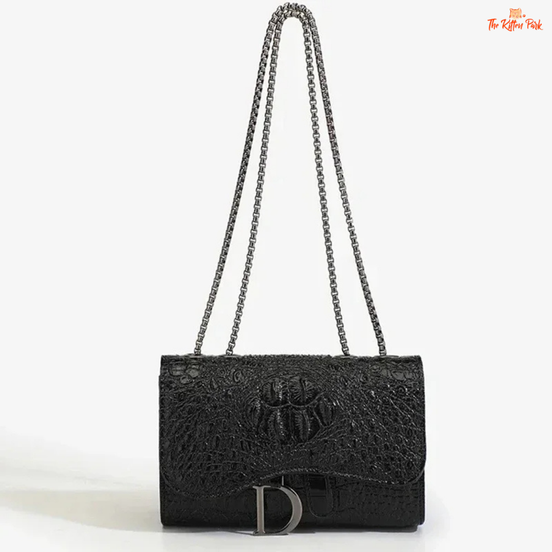 Box-shaped women's crossbody bag with sequins, animal print details, chain strap, and zippered interior for a stylish and glamorous look.