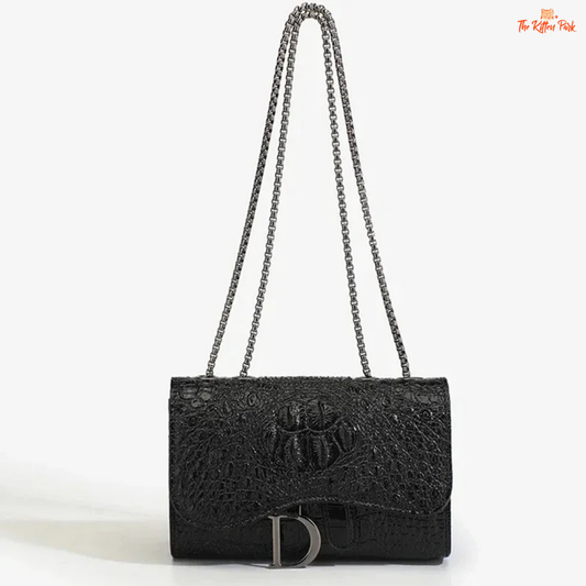 Box-shaped women's crossbody bag with sequins, animal print details, chain strap, and zippered interior for a stylish and glamorous look.