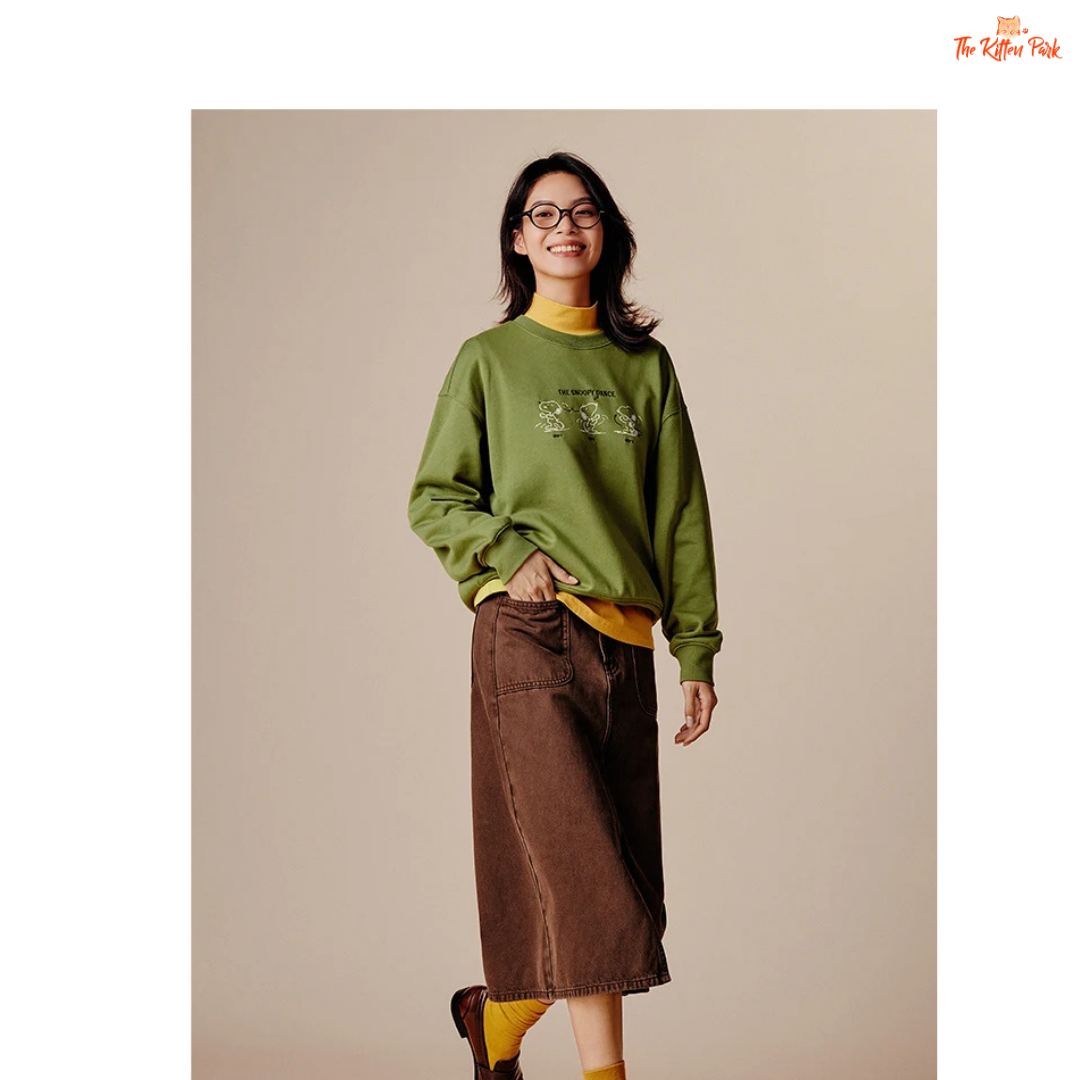 A women’s loose fit autumn sweatshirt with cartoon print, O-neck pullover design, and casual cotton-polyester blend comfort.