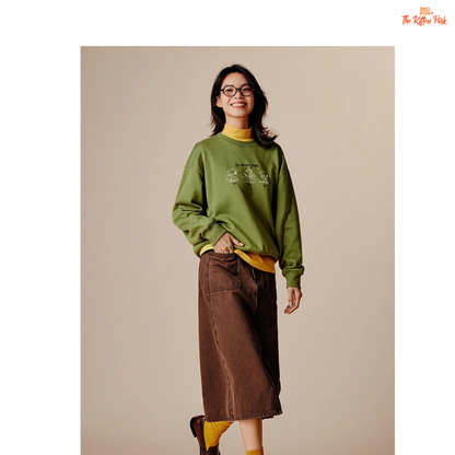 A women’s loose fit autumn sweatshirt with cartoon print, O-neck pullover design, and casual cotton-polyester blend comfort.