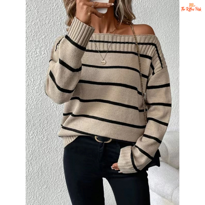 An elegant women’s off shoulder striped knit sweater with a slash neckline, full sleeves, and heavyweight acrylic fabric for autumn and winter wear.