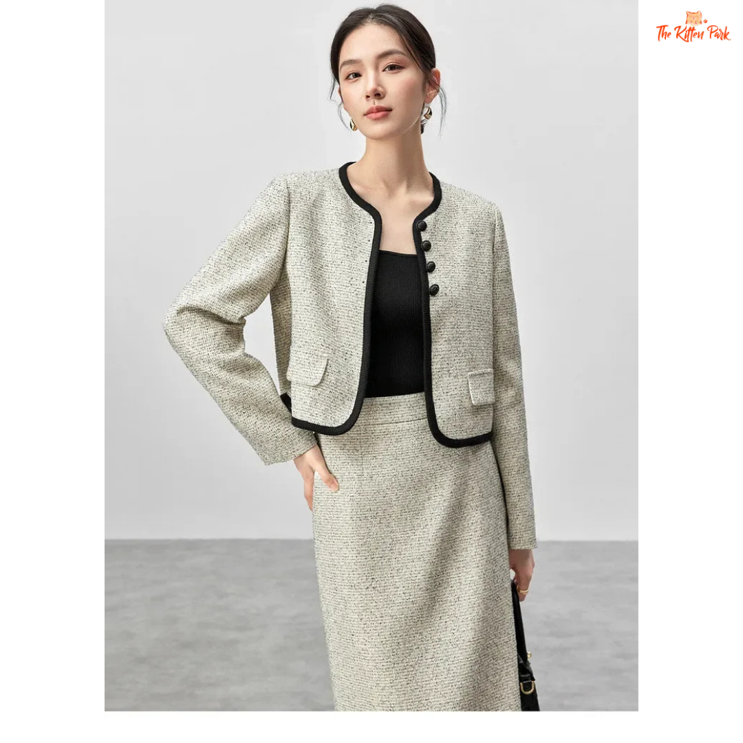 Elegant women’s tweed two-piece skirt set in off-white with contrast trim, featuring a single-breasted jacket and mid-calf skirt for autumn and winter wear.
