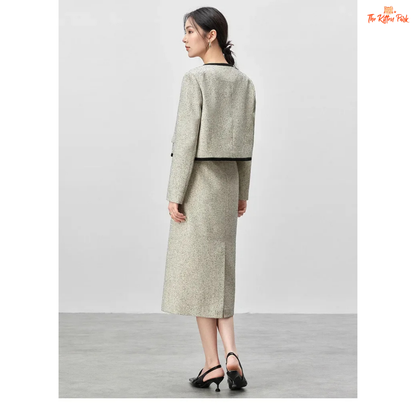 Elegant women’s tweed two-piece skirt set in off-white with contrast trim, featuring a single-breasted jacket and mid-calf skirt for autumn and winter wear.