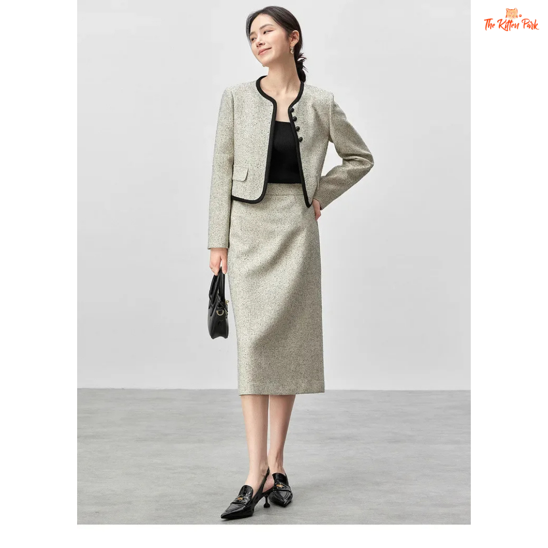 Elegant women’s tweed two-piece skirt set in off-white with contrast trim, featuring a single-breasted jacket and mid-calf skirt for autumn and winter wear.