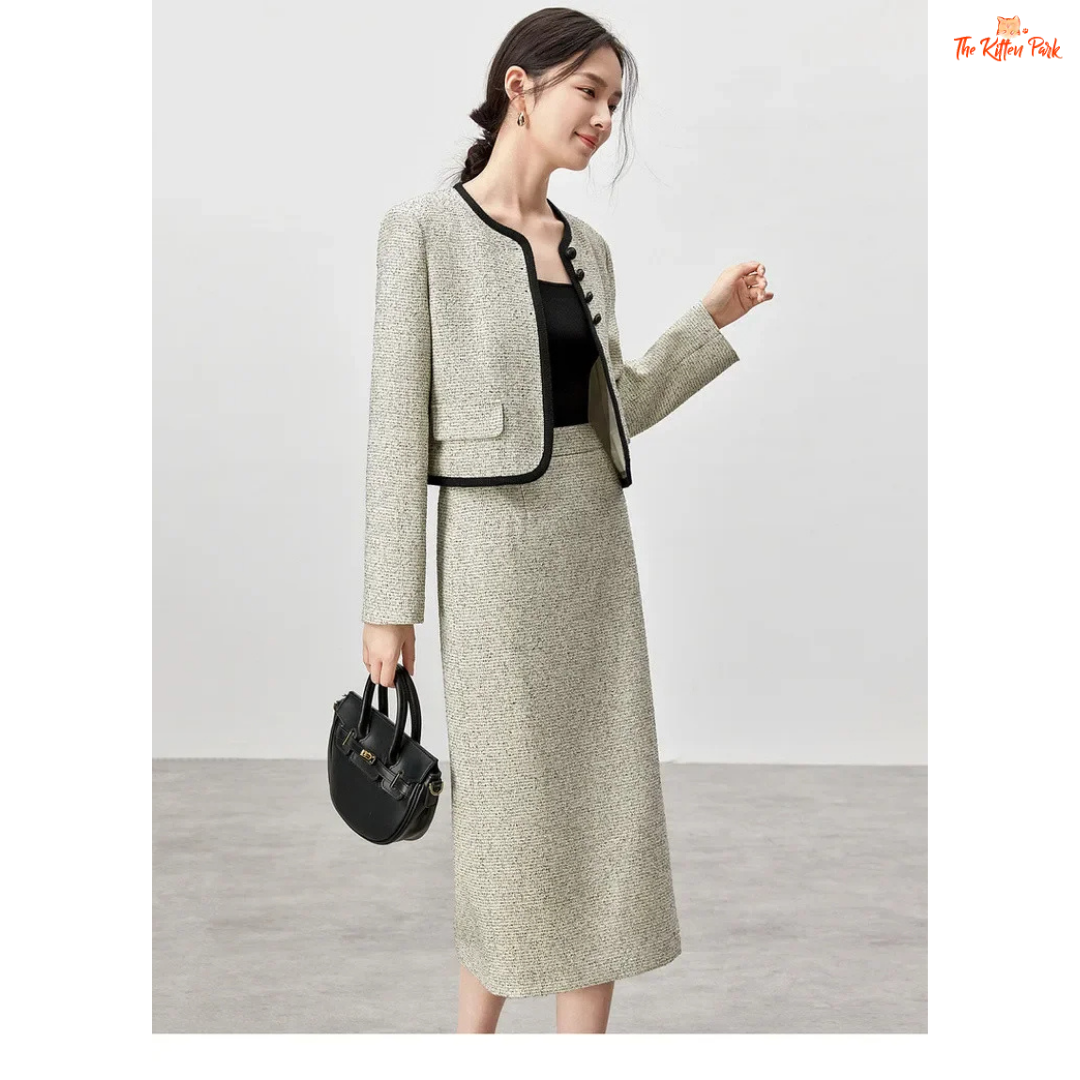 Elegant women’s tweed two-piece skirt set in off-white with contrast trim, featuring a single-breasted jacket and mid-calf skirt for autumn and winter wear.