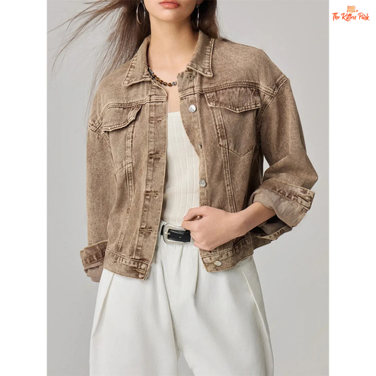 A women’s retro short denim jacket in light camel brown, featuring a button-up front, pockets, and casual long sleeves for autumn and winter wear.
