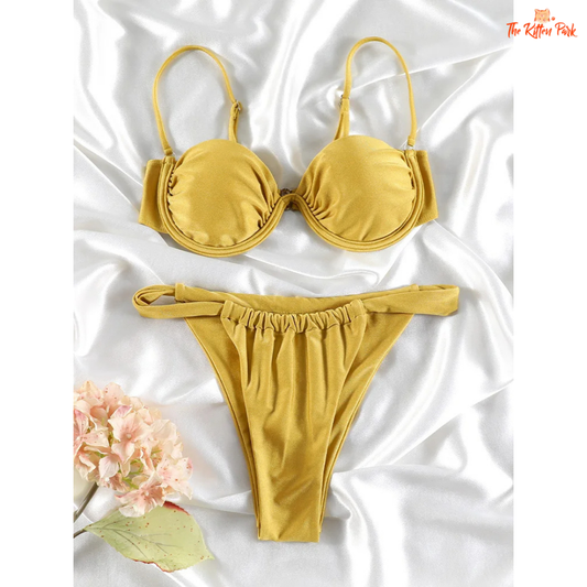 Shiny halter bikini set with underwire push-up top and low-waist thong bottom, made from stretchy polyester and spandex blend.