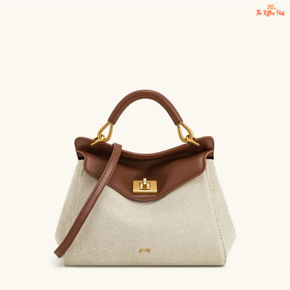 Stylish light luxury women's shoulder bag with lock closure, PU texture, baguette shape, and elegant gold chain accent in soft red and beige tones.