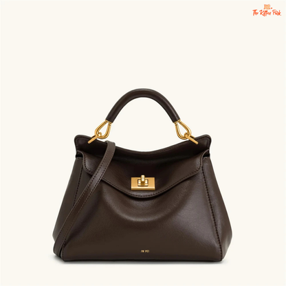 Stylish light luxury women's shoulder bag with lock closure, PU texture, baguette shape, and elegant gold chain accent in soft red and beige tones.
