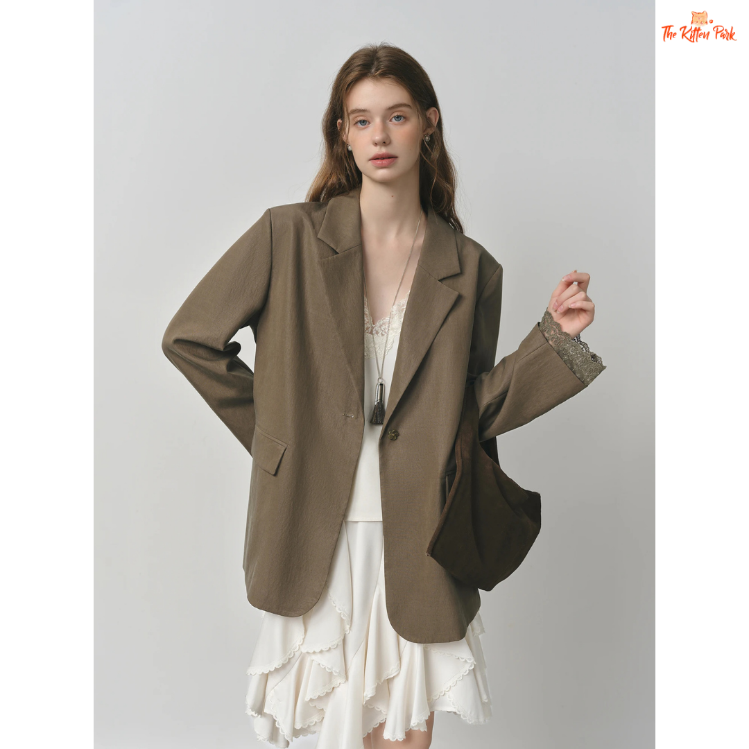 Elegant French-inspired women’s blazer with lace trim, notched collar, single-button closure, and solid design, made from lyocell and polyamide.